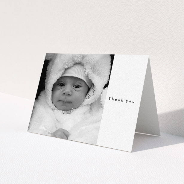 A baby thank you card design called "Most of the Page Frame". It is an A5 card in a landscape orientation. It is a photographic baby thank you card with room for 1 photo. "Most of the Page Frame" is available as a folded card, with mainly white colouring.