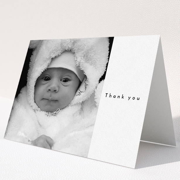 A baby thank you card design called "Most of the Page Frame". It is an A5 card in a landscape orientation. It is a photographic baby thank you card with room for 1 photo. "Most of the Page Frame" is available as a folded card, with mainly white colouring.