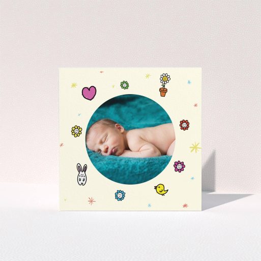 A baby thank you card template titled "Nursery Frame". It is a square (148mm x 148mm) card in a square orientation. It is a photographic baby thank you card with room for 1 photo. "Nursery Frame" is available as a folded card, with tones of cream, pink and yellow.