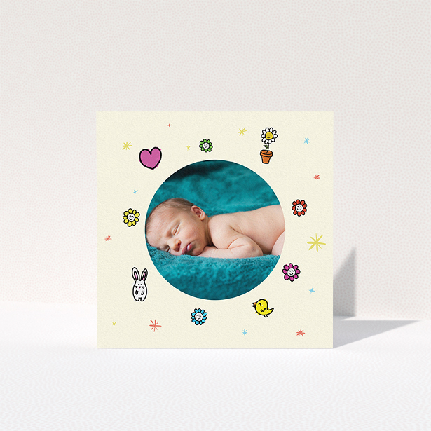 A baby thank you card template titled "Nursery Frame". It is a square (148mm x 148mm) card in a square orientation. It is a photographic baby thank you card with room for 1 photo. "Nursery Frame" is available as a folded card, with tones of cream, pink and yellow.
