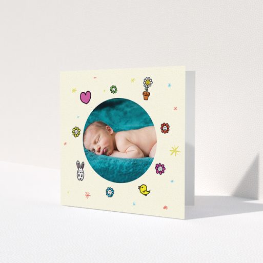 A baby thank you card template titled 'Nursery Frame'. It is a square (148mm x 148mm) card in a square orientation. It is a photographic baby thank you card with room for 1 photo. 'Nursery Frame' is available as a folded card, with tones of cream, pink and yellow.