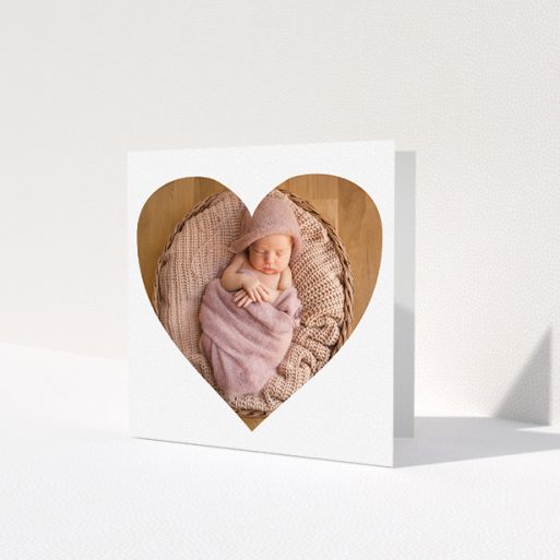 A baby thank you card called 'One Big Heart'. It is a square (148mm x 148mm) card in a square orientation. It is a photographic baby thank you card with room for 1 photo. 'One Big Heart' is available as a folded card, with mainly white colouring.