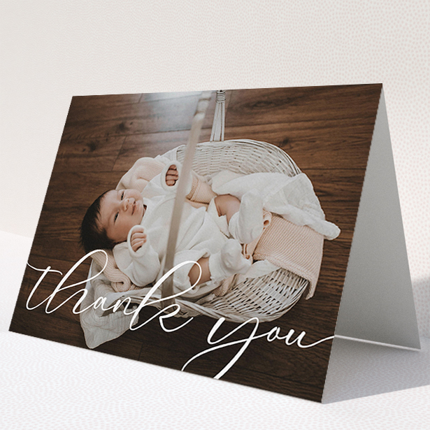 A baby thank you card design called "One Photo". It is an A5 card in a landscape orientation. It is a photographic baby thank you card with room for 1 photo. "One Photo" is available as a folded card, with mainly white colouring.