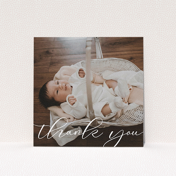 A baby thank you card template titled "One Photo". It is a square (148mm x 148mm) card in a square orientation. It is a photographic baby thank you card with room for 1 photo. "One Photo" is available as a flat card, with mainly white colouring.