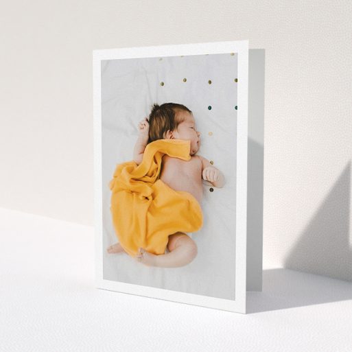 A baby thank you card template titled 'One Photo Thanks'. It is an A5 card in a portrait orientation. It is a photographic baby thank you card with room for 1 photo. 'One Photo Thanks' is available as a folded card, with mainly white colouring.