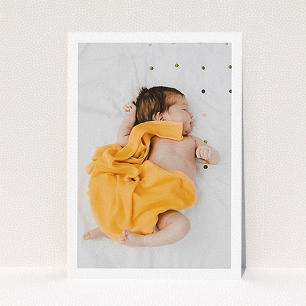 A baby thank you card design titled "One Photo Thanks". It is an A6 card in a portrait orientation. It is a photographic baby thank you card with room for 1 photo. "One Photo Thanks" is available as a flat card, with mainly white colouring.
