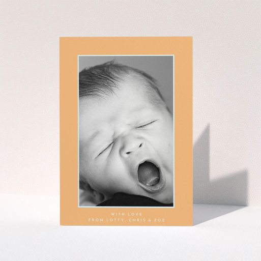A baby thank you card named "Orange and Mint". It is an A5 card in a portrait orientation. It is a photographic baby thank you card with room for 1 photo. "Orange and Mint" is available as a folded card, with tones of orange and blue.