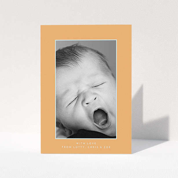 A baby thank you card design named "Orange and Mint". It is an A6 card in a portrait orientation. It is a photographic baby thank you card with room for 1 photo. "Orange and Mint" is available as a folded card, with tones of orange and blue.