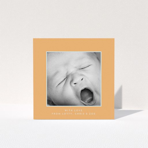 A baby thank you card design called "Orange and Mint". It is a square (148mm x 148mm) card in a square orientation. It is a photographic baby thank you card with room for 1 photo. "Orange and Mint" is available as a folded card, with tones of orange and blue.