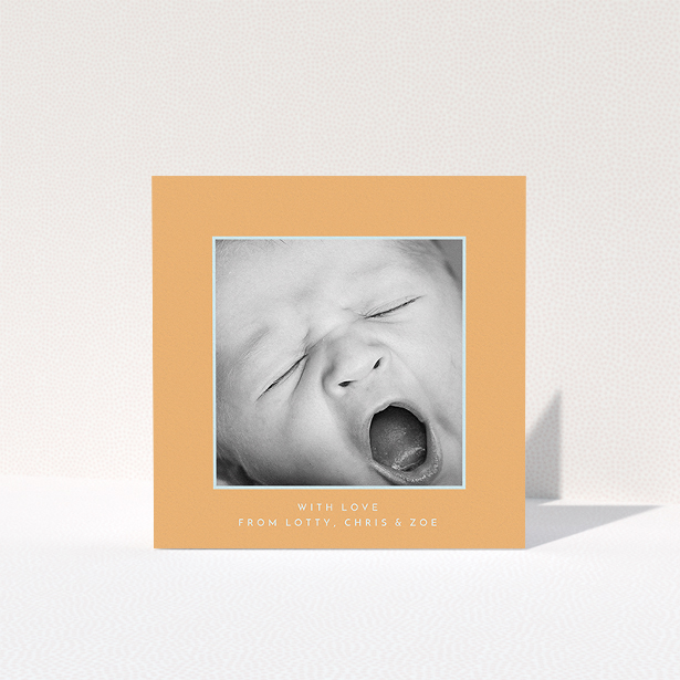 A baby thank you card design called "Orange and Mint". It is a square (148mm x 148mm) card in a square orientation. It is a photographic baby thank you card with room for 1 photo. "Orange and Mint" is available as a folded card, with tones of orange and blue.