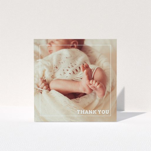 A baby thank you card design called "Over Photo Frame". It is a square (148mm x 148mm) card in a square orientation. It is a photographic baby thank you card with room for 1 photo. "Over Photo Frame" is available as a folded card, with mainly white colouring.