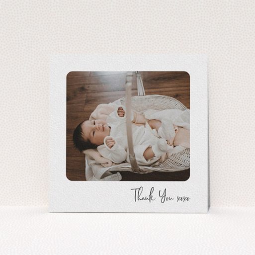 A baby thank you card named "Rounded Thanks". It is a square (148mm x 148mm) card in a square orientation. It is a photographic baby thank you card with room for 1 photo. "Rounded Thanks" is available as a flat card, with mainly white colouring.