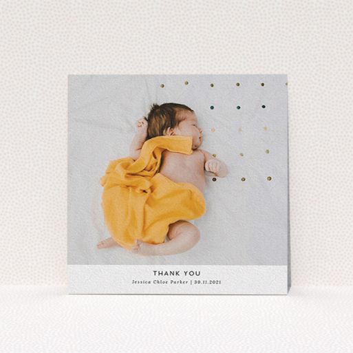 A baby thank you card called "Sans Serif". It is a square (148mm x 148mm) card in a square orientation. It is a photographic baby thank you card with room for 1 photo. "Sans Serif" is available as a flat card, with mainly white colouring.