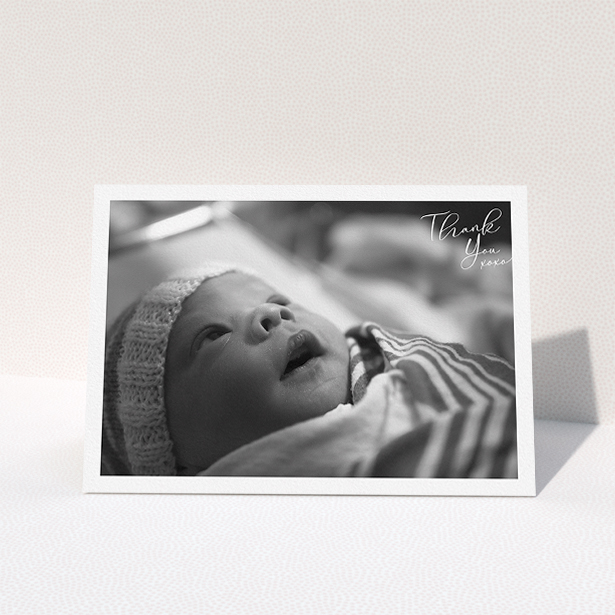 A baby thank you card design titled "Simple Landscape Thanks". It is an A5 card in a landscape orientation. It is a photographic baby thank you card with room for 1 photo. "Simple Landscape Thanks" is available as a folded card, with mainly white colouring.