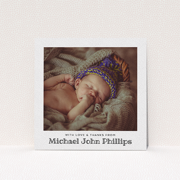 A baby thank you card design called "Simple Photo Frame". It is a square (148mm x 148mm) card in a square orientation. It is a photographic baby thank you card with room for 1 photo. "Simple Photo Frame" is available as a flat card, with mainly white colouring.