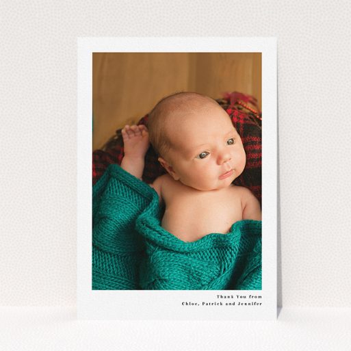 A baby thank you card design called "Simple Portrait". It is an A5 card in a portrait orientation. It is a photographic baby thank you card with room for 1 photo. "Simple Portrait" is available as a flat card, with mainly white colouring.