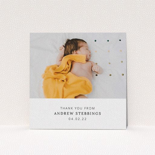 A baby thank you card named "Simple, Portrait Thank You". It is a square (148mm x 148mm) card in a square orientation. It is a photographic baby thank you card with room for 1 photo. "Simple, Portrait Thank You" is available as a flat card, with mainly white colouring.