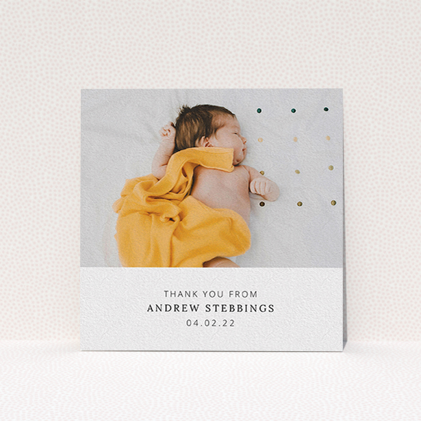 A baby thank you card named "Simple, Portrait Thank You". It is a square (148mm x 148mm) card in a square orientation. It is a photographic baby thank you card with room for 1 photo. "Simple, Portrait Thank You" is available as a flat card, with mainly white colouring.
