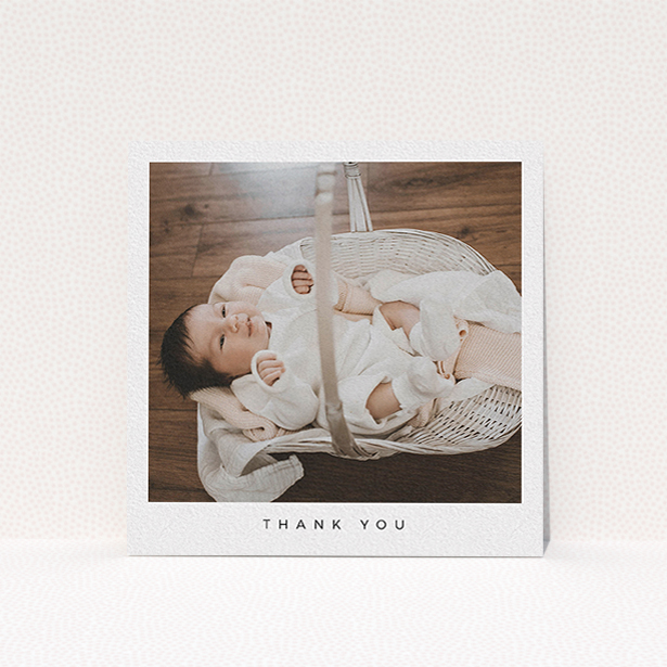 A baby thank you card called "Simple". It is a square (148mm x 148mm) card in a square orientation. It is a photographic baby thank you card with room for 1 photo. "Simple" is available as a flat card, with mainly white colouring.