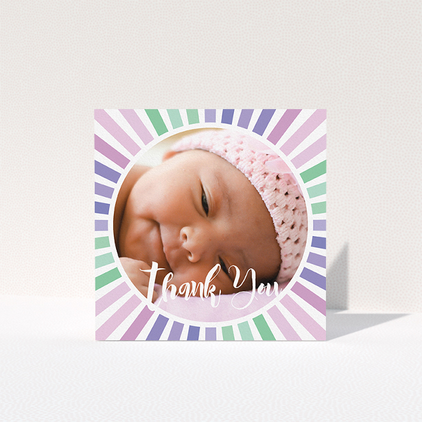 A baby thank you card design titled "Sun Centre". It is a square (148mm x 148mm) card in a square orientation. It is a photographic baby thank you card with room for 1 photo. "Sun Centre" is available as a folded card, with mainly light pink colouring.