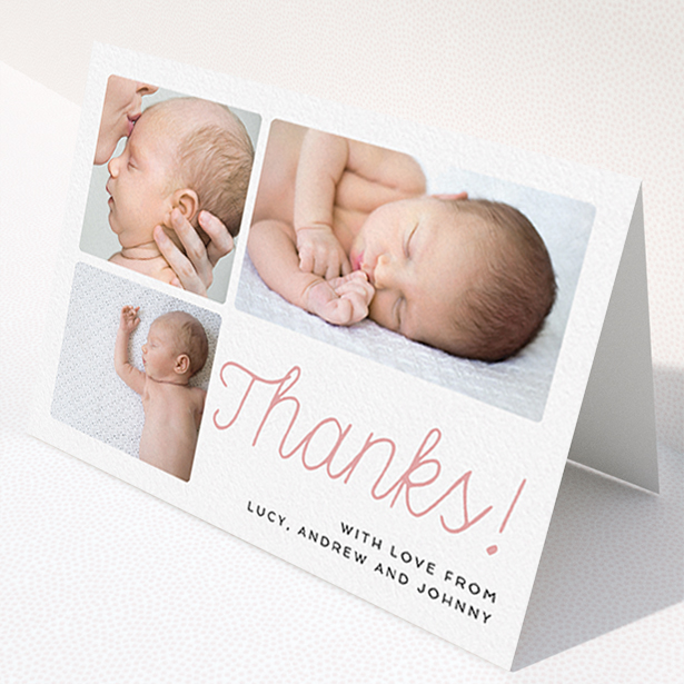 A baby thank you card template titled "Thank You Cursive". It is an A6 card in a landscape orientation. It is a photographic baby thank you card with room for 3 photos. "Thank You Cursive" is available as a folded card, with tones of white and pink.