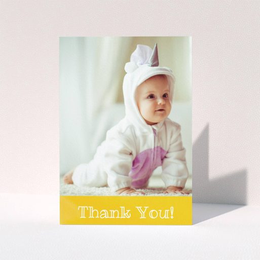 A baby thank you card design called "Thanks In Yellow". It is an A5 card in a portrait orientation. It is a photographic baby thank you card with room for 1 photo. "Thanks In Yellow" is available as a folded card, with tones of yellow and white.