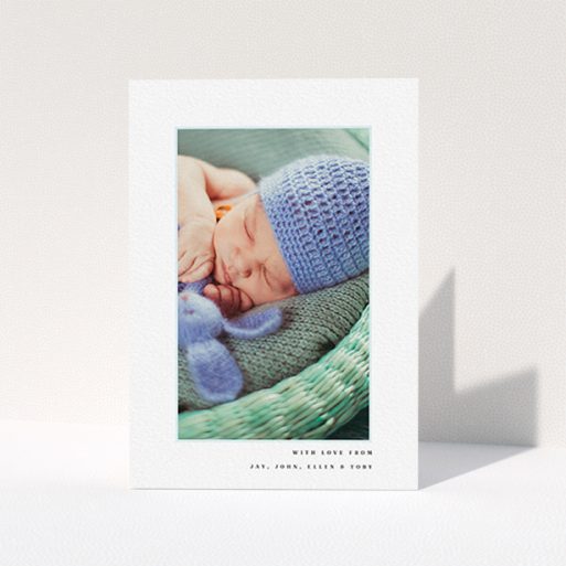 A baby thank you card template titled "Thin Blue Frame". It is an A6 card in a portrait orientation. It is a photographic baby thank you card with room for 1 photo. "Thin Blue Frame" is available as a folded card, with tones of white and blue.