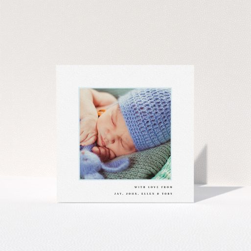 A baby thank you card design named "Thin Blue Frame". It is a square (148mm x 148mm) card in a square orientation. It is a photographic baby thank you card with room for 1 photo. "Thin Blue Frame" is available as a folded card, with tones of white and blue.