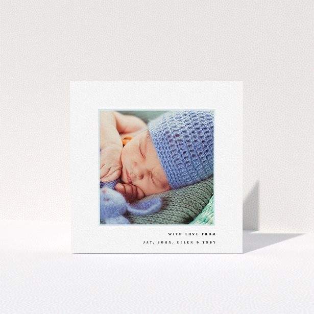 A baby thank you card design named "Thin Blue Frame". It is a square (148mm x 148mm) card in a square orientation. It is a photographic baby thank you card with room for 1 photo. "Thin Blue Frame" is available as a folded card, with tones of white and blue.
