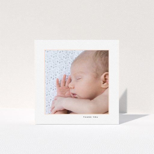 A baby thank you card template titled "Thin Pink Frame". It is a square (148mm x 148mm) card in a square orientation. It is a photographic baby thank you card with room for 1 photo. "Thin Pink Frame" is available as a folded card, with tones of white and pink.