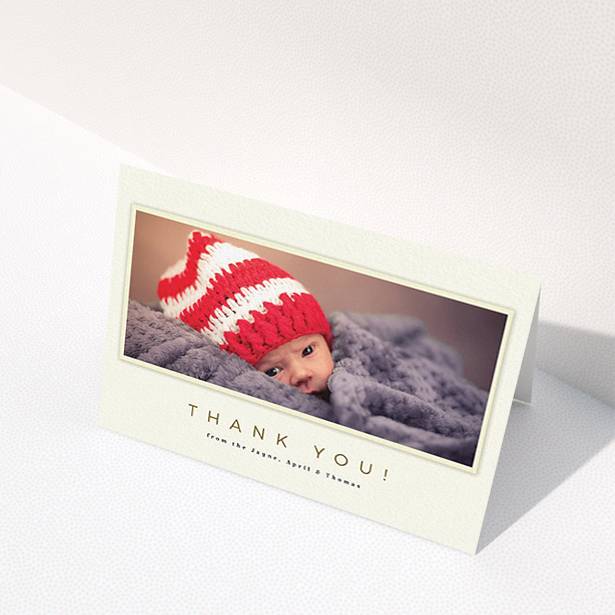A baby thank you card design called "Torn Cream Frame". It is an A6 card in a landscape orientation. It is a photographic baby thank you card with room for 1 photo. "Torn Cream Frame" is available as a folded card, with mainly cream colouring.