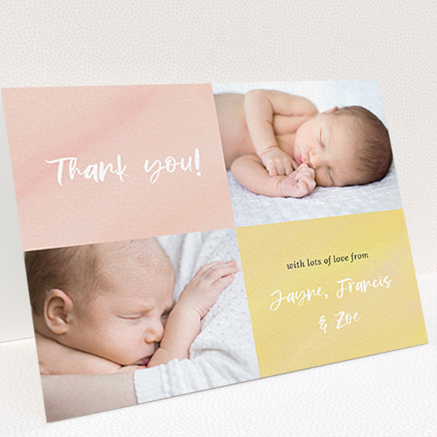 A baby thank you card design titled "Watercolour Corners". It is an A6 card in a landscape orientation. It is a photographic baby thank you card with room for 2 photos. "Watercolour Corners" is available as a folded card, with tones of yellow and purple.