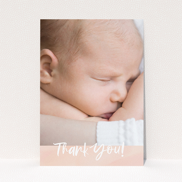 A baby thank you card design titled "Watercolour Thanks". It is an A5 card in a portrait orientation. It is a photographic baby thank you card with room for 1 photo. "Watercolour Thanks" is available as a flat card, with tones of pink and white.