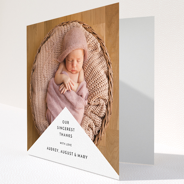 A baby thank you card called "Wedge Frame". It is a square (148mm x 148mm) card in a square orientation. It is a photographic baby thank you card with room for 1 photo. "Wedge Frame" is available as a folded card, with mainly white colouring.