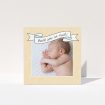 A baby thank you card called "Written Above". It is a square (148mm x 148mm) card in a square orientation. It is a photographic baby thank you card with room for 1 photo. "Written Above" is available as a folded card, with tones of faded yellow and light blue.