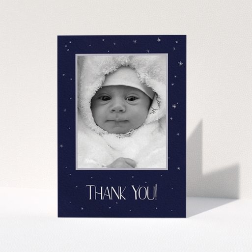 A baby thank you card design called "Written in the Stars". It is an A6 card in a portrait orientation. It is a photographic baby thank you card with room for 1 photo. "Written in the Stars" is available as a folded card, with tones of navy blue and white.