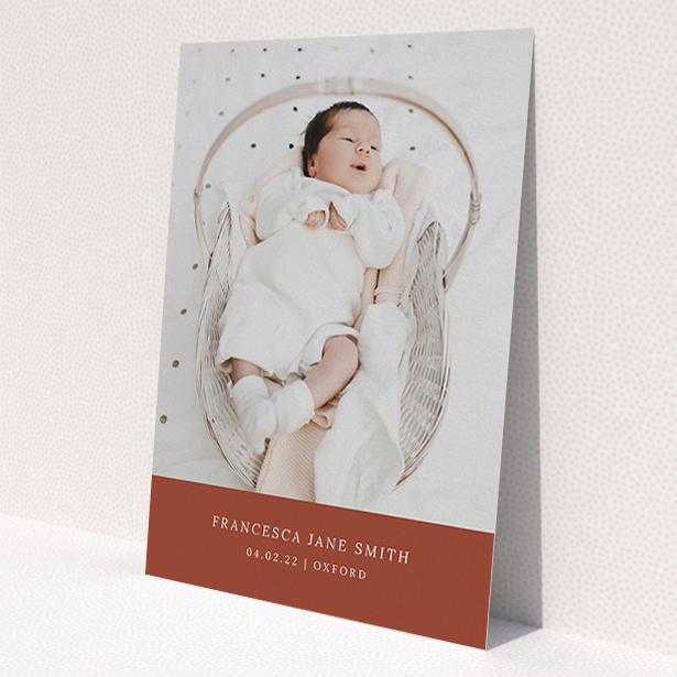 A baptism invitation design named "Autumnal Photo". It is an A5 invite card in a portrait orientation. It is a photographic baptism invitation with room for 1 photo. "Autumnal Photo" is available as a flat invite card, with mainly dark orange colouring.