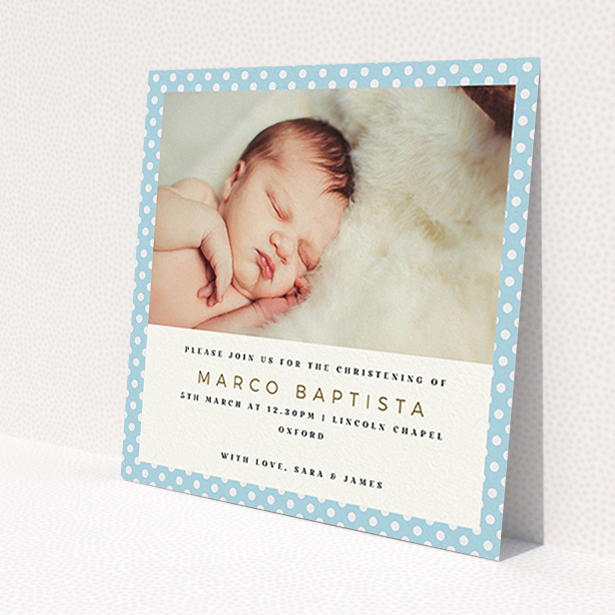 A baptism invitation named 'Blue Polkadots'. It is a square (148mm x 148mm) invite card in a square orientation. It is a photographic baptism invitation with room for 1 photo. 'Blue Polkadots' is available as a flat invite card, with tones of blue and white.