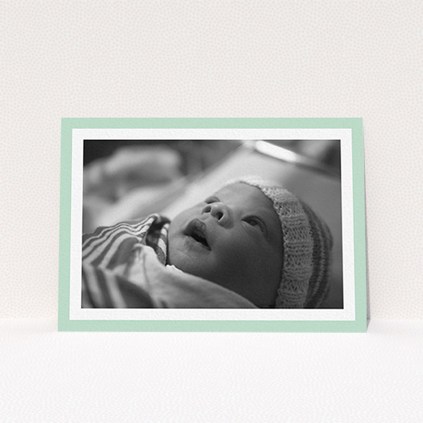 A baptism invitation named "Classic Mint Photo Frame". It is an A6 invite card in a landscape orientation. It is a photographic baptism invitation with room for 1 photo. "Classic Mint Photo Frame" is available as a flat invite card, with tones of green and white.