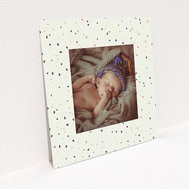 A baptism invitation named "Dot-dot-dot". It is a square (148mm x 148mm) invite card in a square orientation. It is a photographic baptism invitation with room for 1 photo. "Dot-dot-dot" is available as a flat invite card, with mainly cream colouring.