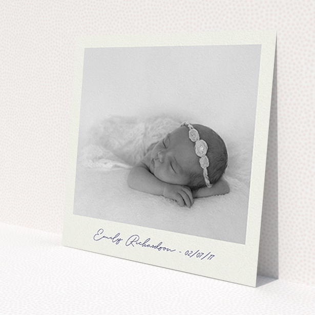 A baptism invitation named 'Instant Photo Frame'. It is a square (148mm x 148mm) invite card in a square orientation. It is a photographic baptism invitation with room for 1 photo. 'Instant Photo Frame' is available as a flat invite card, with mainly pale cream colouring.