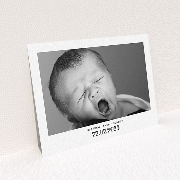 A baptism invitation called "Ornate Date". It is an A5 invite card in a landscape orientation. It is a photographic baptism invitation with room for 1 photo. "Ornate Date" is available as a flat invite card, with mainly white colouring.