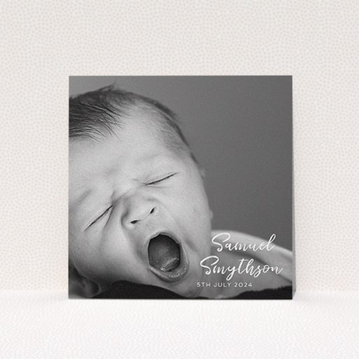 A baptism invitation called "Soho Script". It is a square (148mm x 148mm) invite card in a square orientation. It is a photographic baptism invitation with room for 1 photo. "Soho Script" is available as a flat invite card, with mainly white colouring.