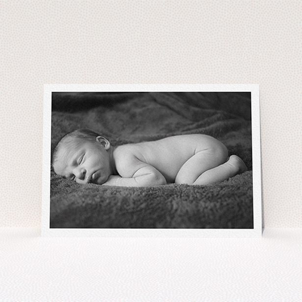 A baptism invitation called "Thick White Framed Photo". It is an A6 invite card in a landscape orientation. It is a photographic baptism invitation with room for 1 photo. "Thick White Framed Photo" is available as a flat invite card, with mainly white colouring.