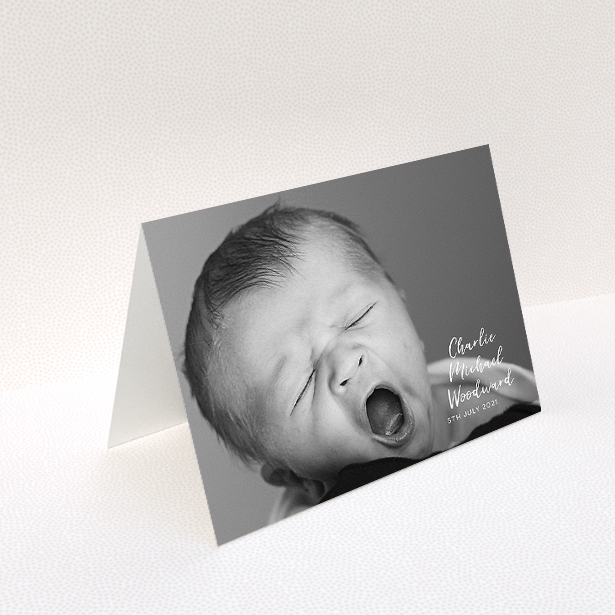 A baptism thank you card design called "1 Photo Full". It is an A5 card in a landscape orientation. It is a photographic baptism thank you card with room for 1 photo. "1 Photo Full" is available as a folded card, with mainly white colouring.