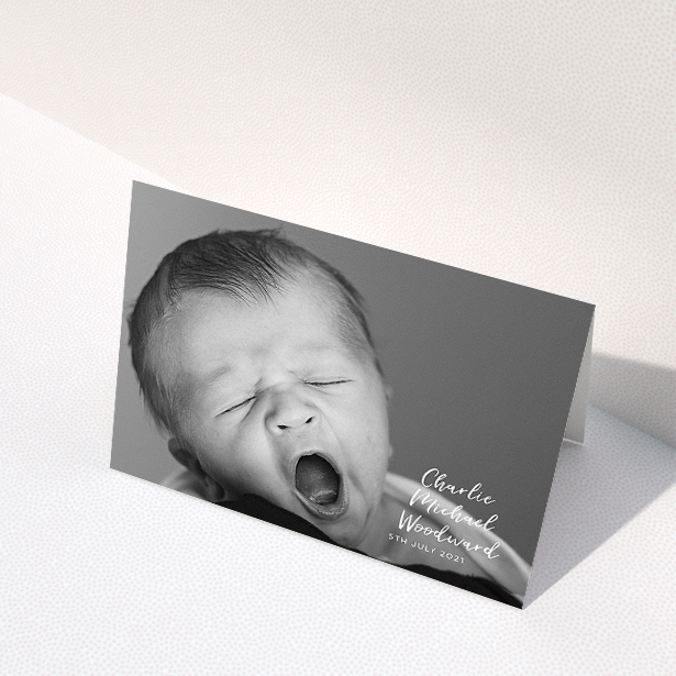 A baptism thank you card design called "1 Photo Full". It is an A5 card in a landscape orientation. It is a photographic baptism thank you card with room for 1 photo. "1 Photo Full" is available as a folded card, with mainly white colouring.