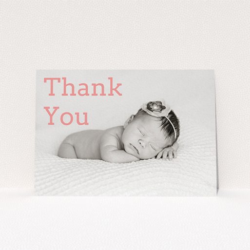 A baptism thank you card design called "Big Thanks". It is an A6 card in a landscape orientation. It is a photographic baptism thank you card with room for 1 photo. "Big Thanks" is available as a flat card, with mainly light pink colouring.