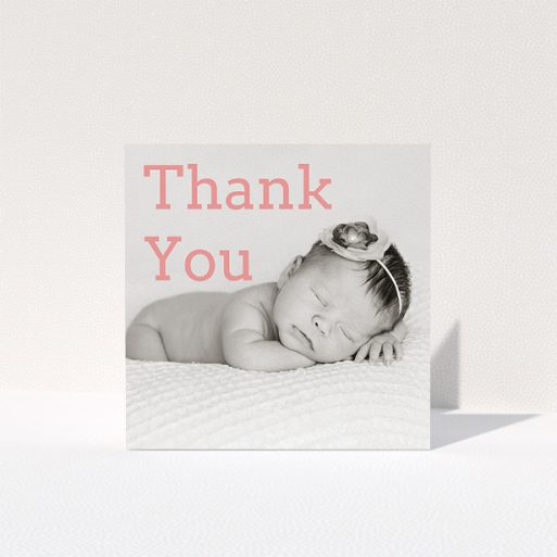 A baptism thank you card design called "Big Thanks". It is a square (148mm x 148mm) card in a square orientation. It is a photographic baptism thank you card with room for 1 photo. "Big Thanks" is available as a folded card, with mainly light pink colouring.