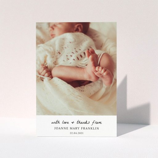 A baptism thank you card design named "Black and White Thanks". It is an A5 card in a portrait orientation. It is a photographic baptism thank you card with room for 1 photo. "Black and White Thanks" is available as a folded card, with mainly white colouring.