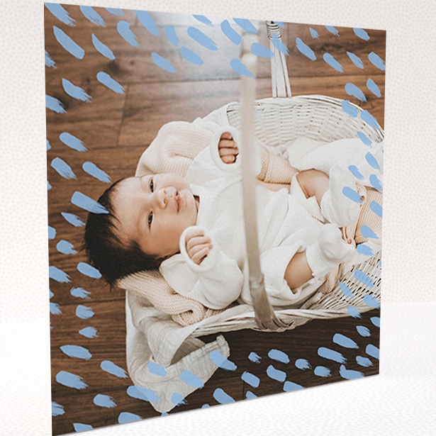 A baptism thank you card design called "Blue Daubs". It is a square (148mm x 148mm) card in a square orientation. It is a photographic baptism thank you card with room for 1 photo. "Blue Daubs" is available as a folded card, with mainly blue colouring.